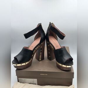 BCBGMAXAZRIA "Nyla" black leather platform sandals with gold stud detailing